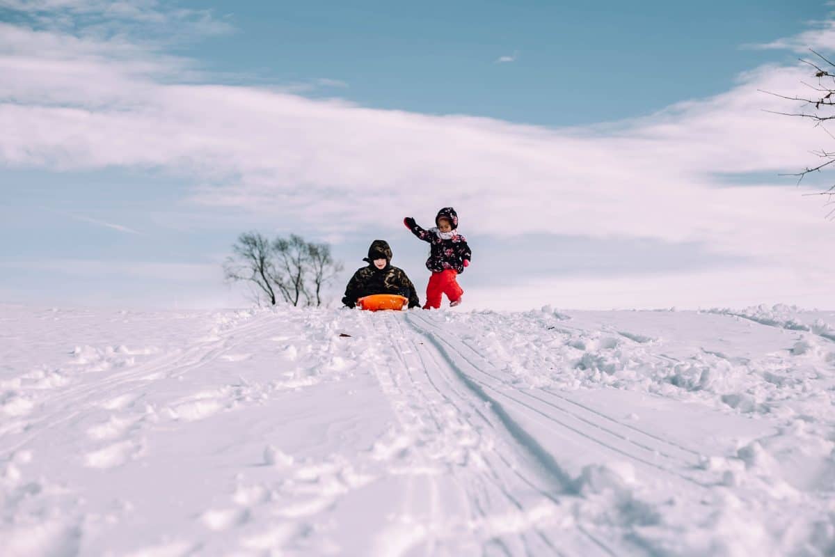 snow day sledding with kids