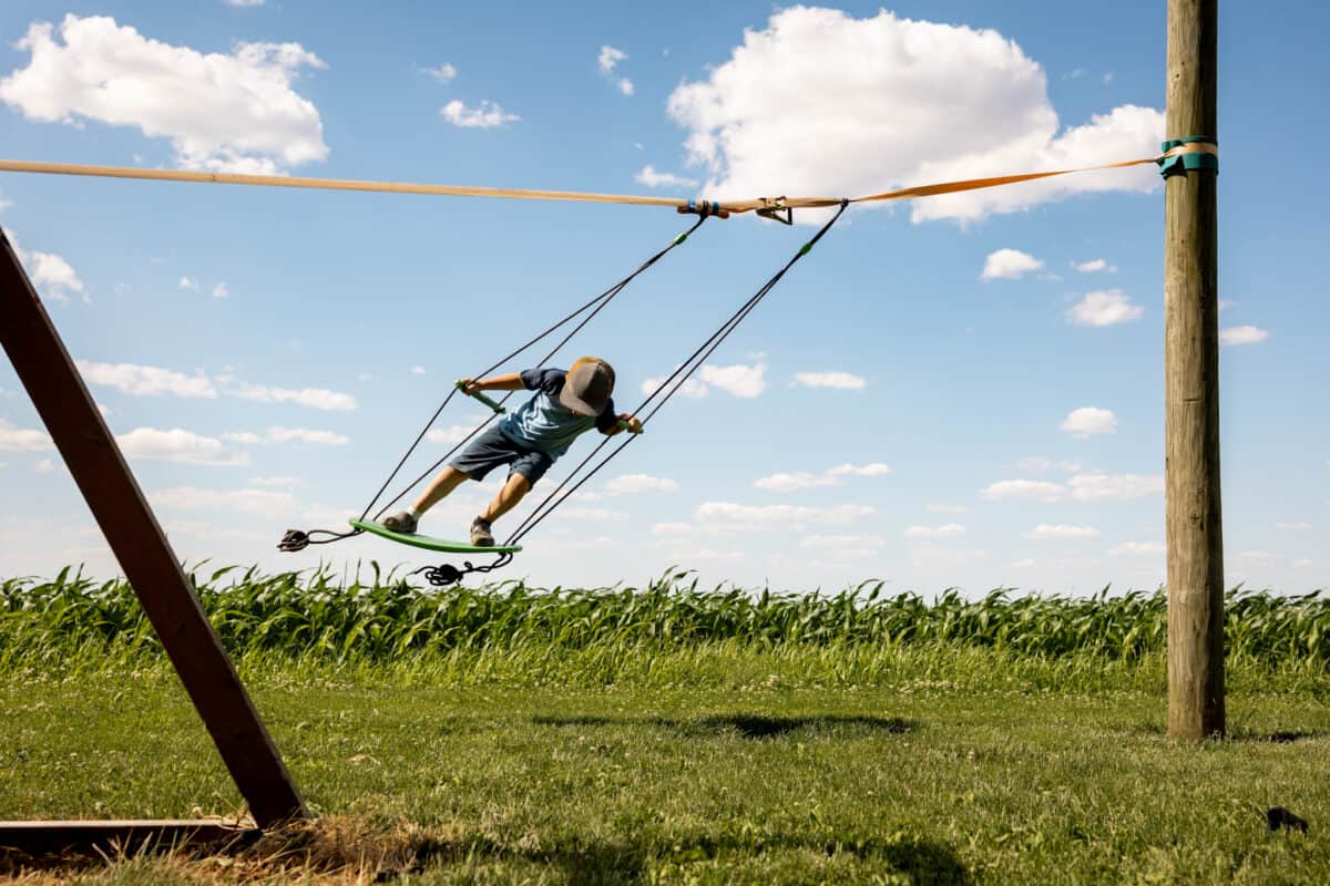 Boy on surf swing swinging to the side