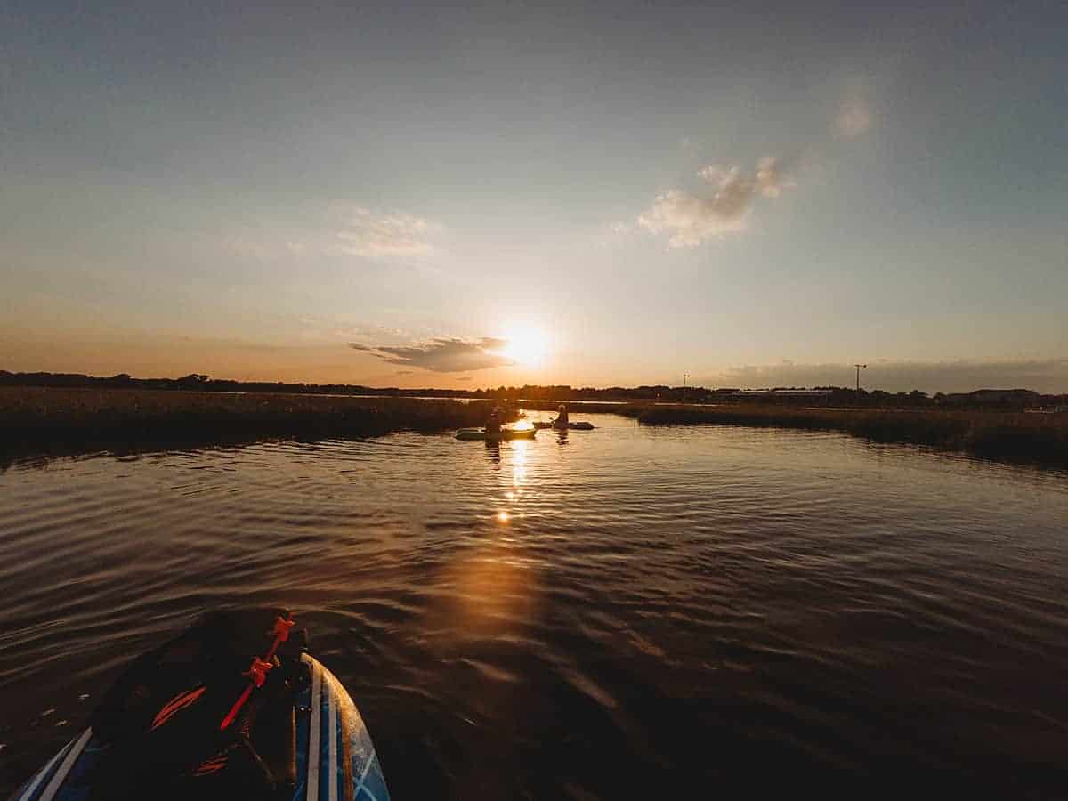 sunset paddleboarding and kayaking with kids