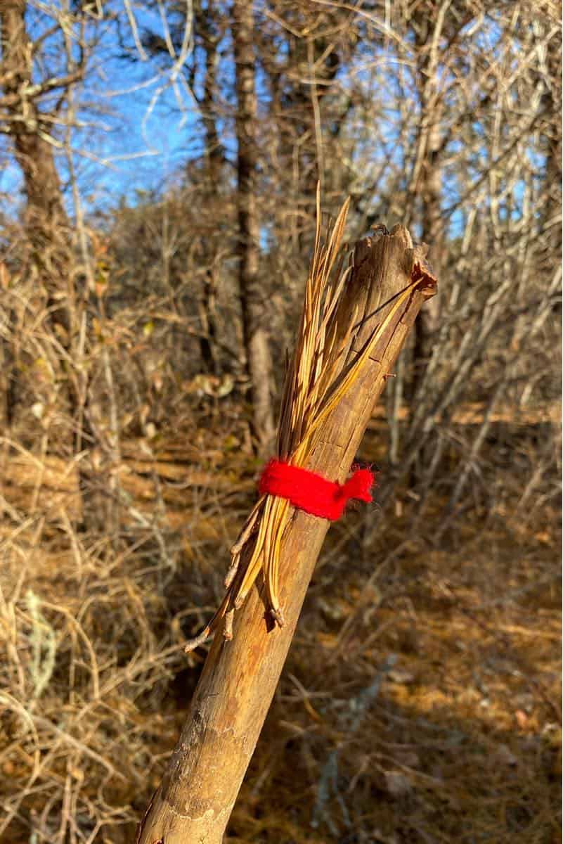 tying items to journey stick