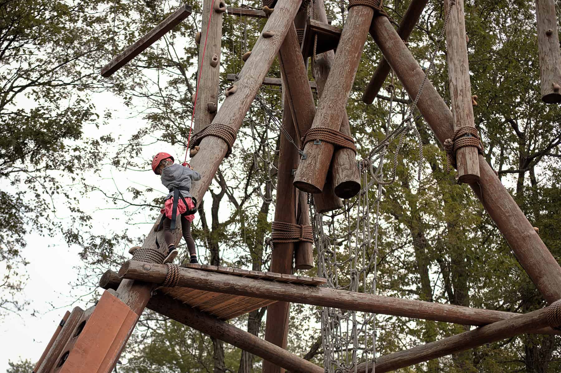 little girl climbing tower