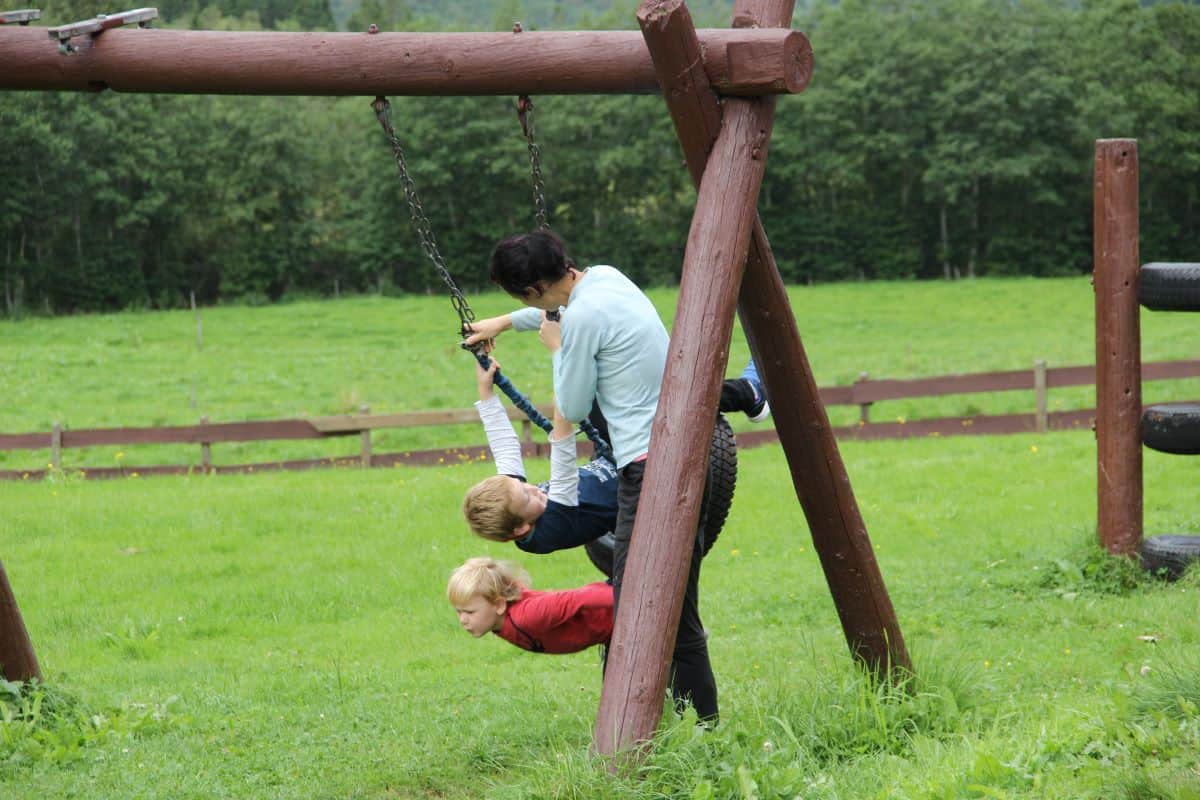 a mum and her children at the playground