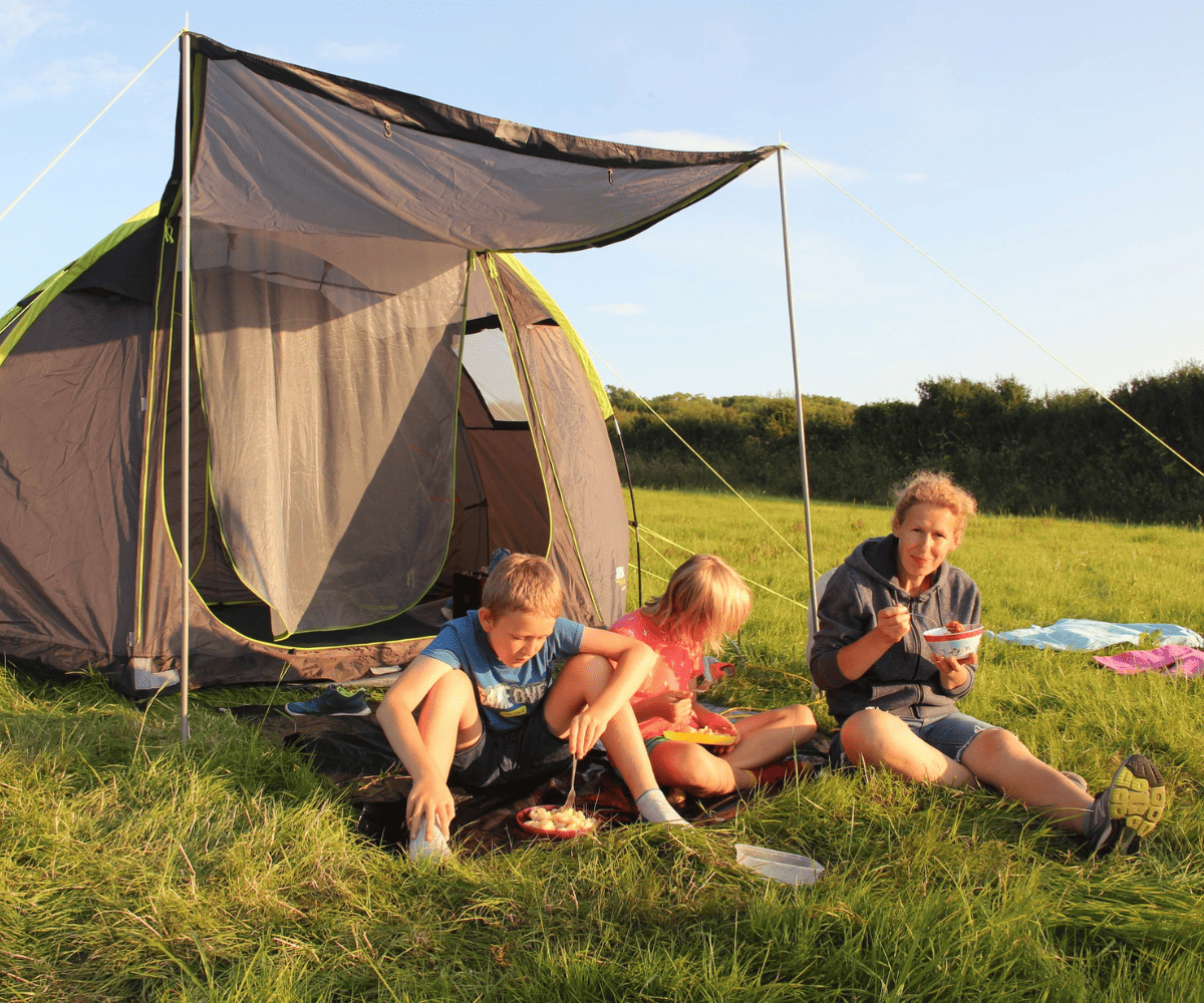 Camping and eating a picnic together as a family