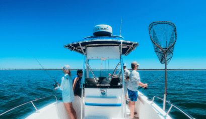 teens fishing off the side of a fishing charter boat in gulf county florida