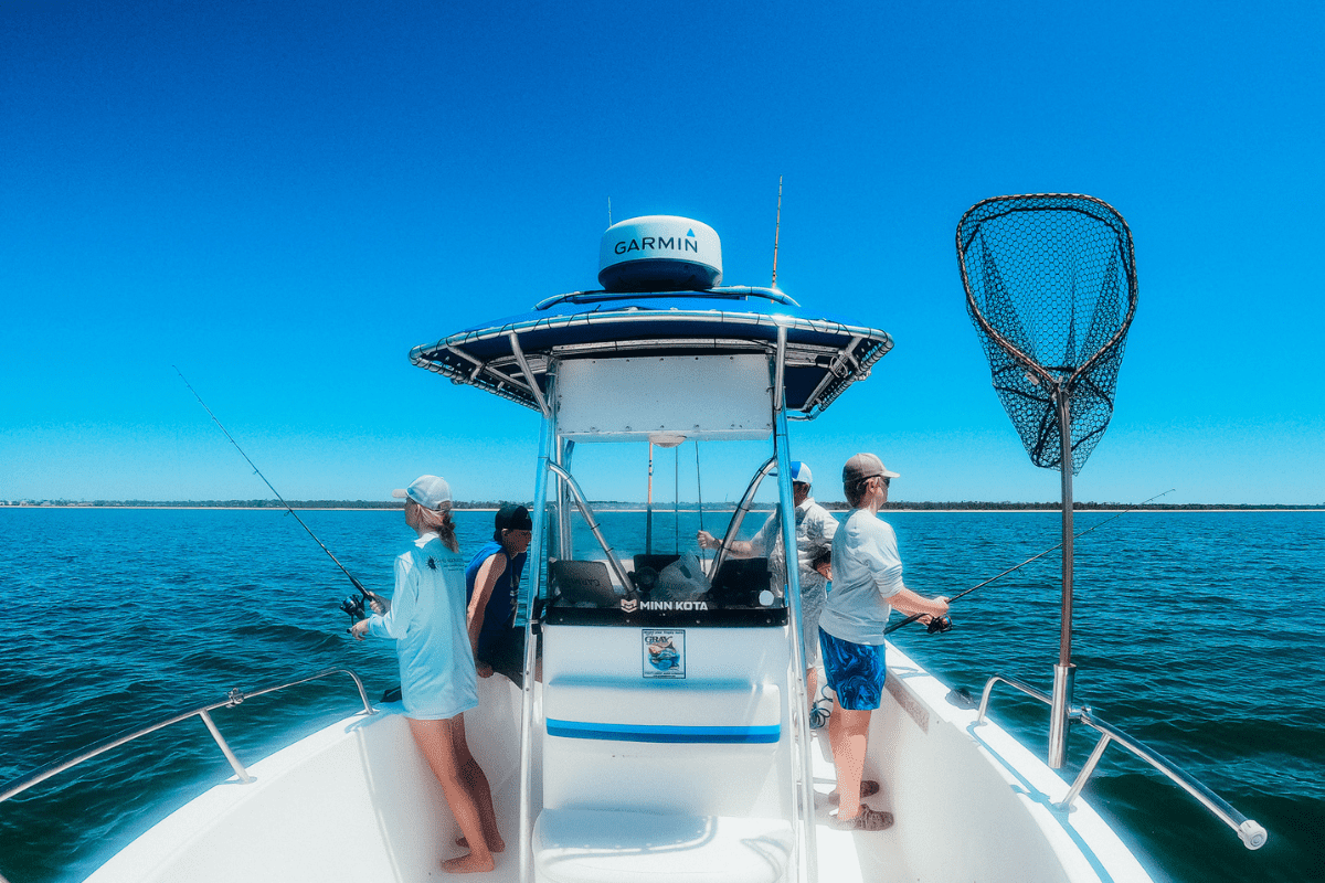 teens fishing off the side of a fishing charter boat in gulf county florida