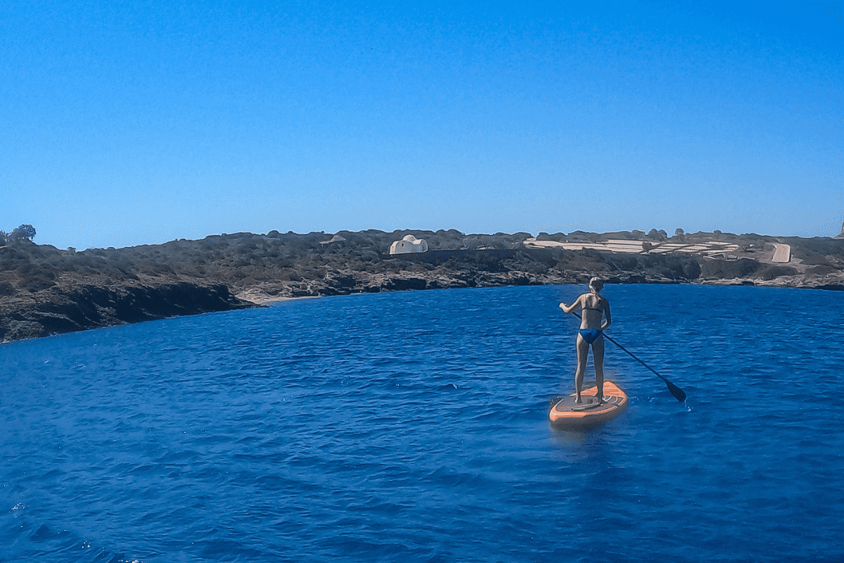 Teen girl SUP in the Aegean Sea