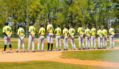 high school baseball team lined up prior to the start of the game