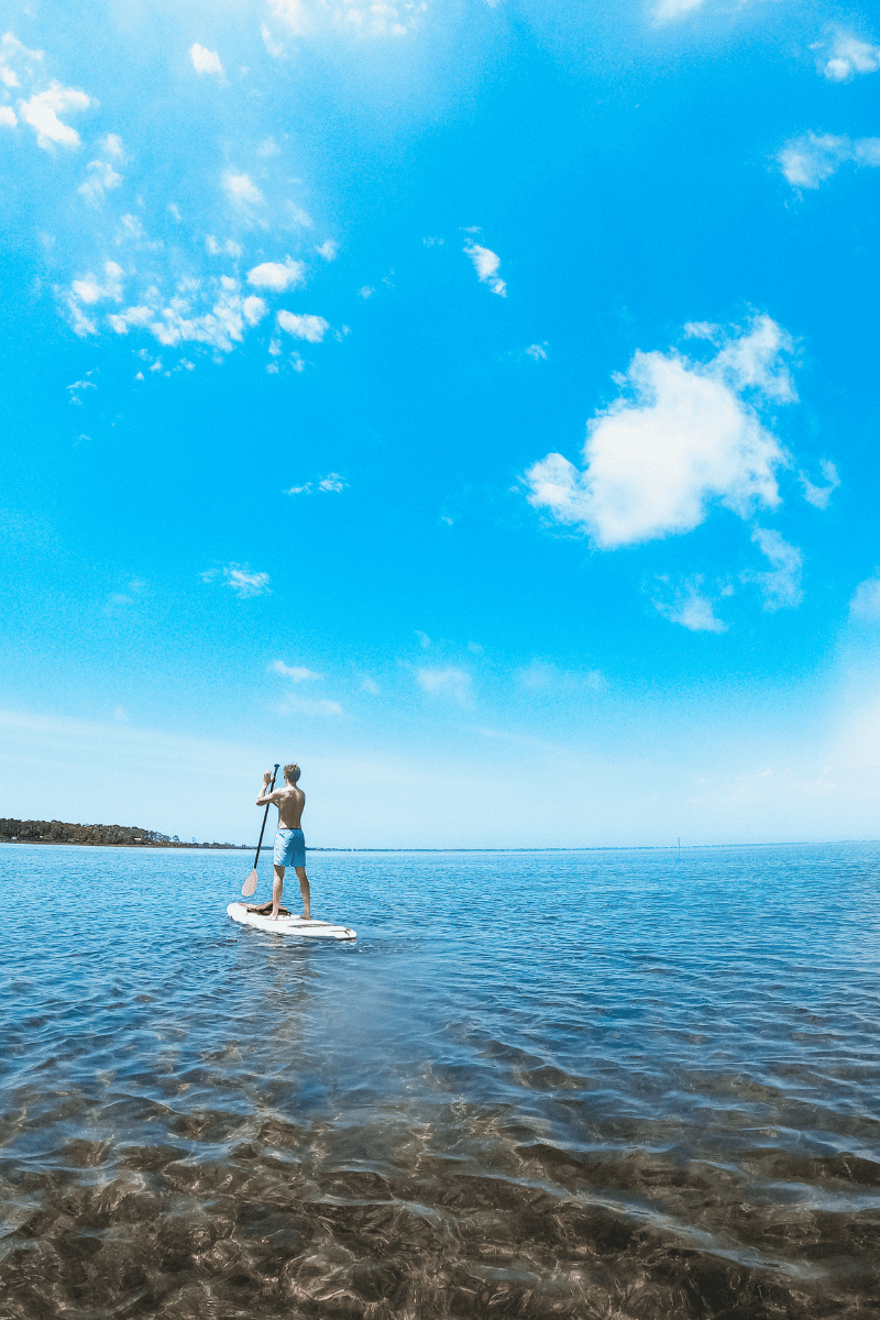 teen boy on an SUP in St. Joseph's Bay